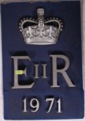 A vintage (believed Police related ) wall plaque - ER II - 1971 with crown to the top.
