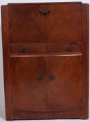 A 1930's Art Deco walnut cocktail drinks cabinet.