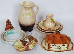 A collection of ceramics to include a West German vase, Wade dishes, Hornsea fauna, and other items.