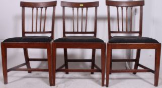 A set of 3 19th century Georgian mahogany dining chairs raised on squared supports with peripheral