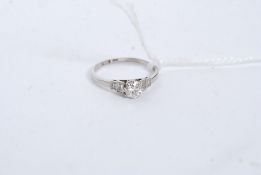 An 18ct gold and platinum diamond ring, 60pts total.