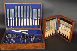 An Edwardian mahogany cased canteen of cutlery together with a large cased canteen of cutlery.
