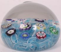 A Perthshire 1976 blue filigree and cane glass paperweight.