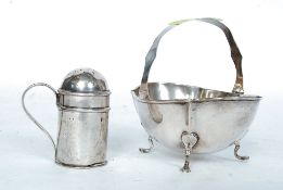 A silver sugar basket ( tested silver ) raised on pad feet along with pepper shaker stamped for