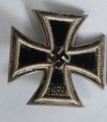 A WWII German Second World War Nazi iron cross 1st class medal  with brooch pin back.