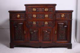 A late 19th century Victorian mahogany breakfront sideboard.