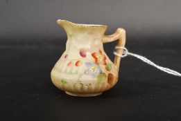 A Royal Worcester circular tapered jug painted floral decoration on blush ground, no.