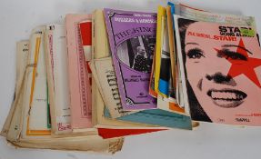 A small collection of sheet music to include Abba, Paul Simon, Ringo Starr and others.