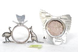 An unusual Silver plate picture frame in the Shape of Tasmania standing on an easel frame along