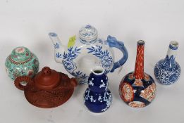 A collection of Chinese ceramic wares to include a moon flask,