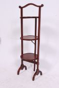 An Edwardian 3 tier metamorphic mahogany cake stand