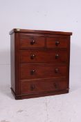 A Victorian mahogany two over three chest of drawers, with caddy style top,