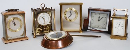 A collection of clocks to include a saucepan Tempora wall clock, Woodford carriage clock,