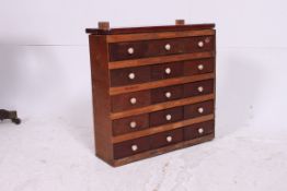 A vintage 20th century scratchbuilt 15 drawers mahogany specimen cabinet of heavy construction with