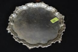 A large hallmarked silver Payton, Pepper & Sons salver standing on three claw feet,