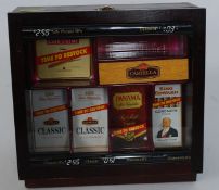 A vintage / retro shop cigar display cabinet in mahogany with lined interior having some notation.