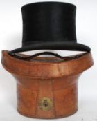 A fabulous early 20th century top hat, within a good original leather case.