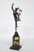 A Victorian 19th century bronze garniture of Hermes being raised on a marble stone socle base