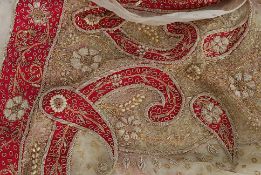 An Indian cream tissue silk shawl, with pink silk, pearl and gold thread decoration,