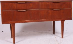 A vintage 1970's teak wood sideboard with four drawers and drop detail handles being raised on