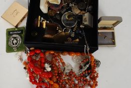 A jewellery box containing a small quantity of assorted costume jewellery - necklaces,