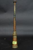An 18th / 19th century Tibetan temple horn of tapering cylindrical form having brass banded mounts