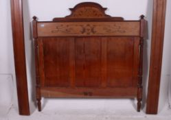 A late 19th cenutry Pitch Pine Art Nouveau 3/4 bed having marquetry inlaid details.
