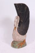A decorative 20th century carved and handpainted wooden stick stand in the form of a swan.