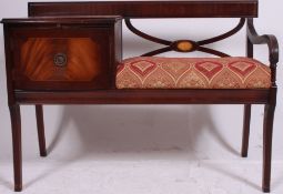 An Edwardian style mahogany inlaid telephone table of good construction raised on tapered supports