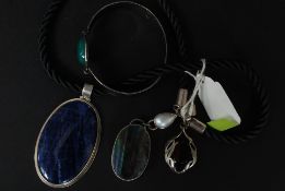 A selection of silver jewellery to include necklace set with a large cabouchon stone a bracelet and
