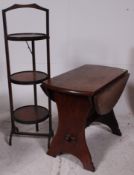 A 1930's Ipswitch oak drop leaf side / lamp hall table raised on lyre shaped supports together with