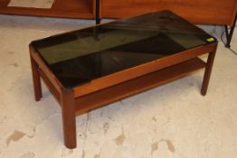 A retro 1970's smoked glass and teak wood rectangular coffee table with lower tier and chamfered