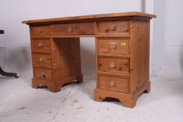 A contemporary pine twin pedestal desk.