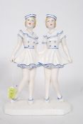 An Art Deco ceramic figure of two sailor girls,