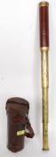 A 19th century leather cased 3 draw brass telescope having a retailers label to the inside of the