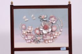 An Edwardian mahogany shellwork and silk fire screen.