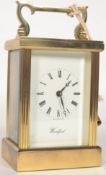 A 20th century Woodford skeleton brass carriage clock, with brass movement.