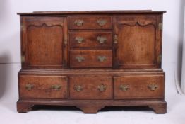 An 18th century and later  country Georgian oak housekeepers cupboard being converted to a