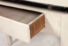 A 1950's vintage enamel metal and wooden kitchen serving table raised on squared legs with fitted