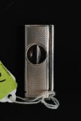 A silver hallmarked cigar cutter bearing marks for Birmingham 1958. Monogram and date to side.