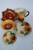 A set of hand painted Sunflower ceramic dishes and jug by Tuscan
