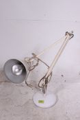 A vintage retro white Herbert Terry anglepoise lamp.