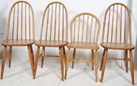 A set of 3 Ercol style stick back light oak dining chairs together with an Ercol Windsor dining
