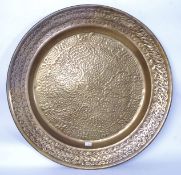 A vintage large 20th century Islamic brass hammered wall charger.