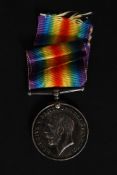 A World War One Great War 1914-1918 Medal being awarded to t-255011 Private RW.