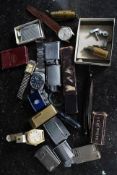 A mixed lot to include various lighters, razor, watches and other assorted similar items.