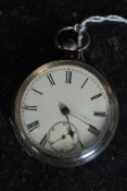 An antique silver pocket watch, unnamed. With hallmarks to the inside of the case, with enamel face.
