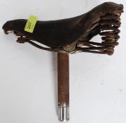 A vintage 20th century cycling / bicycle saddle by Brooks having embossed leather saddle top and