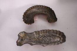 A pair of 20th century copper jelly moulds in the form of fish.