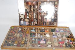 2x wall displays, the first being filled with predominantly sea shells, but also other items,